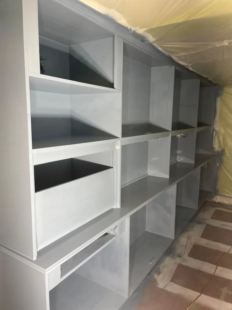 Built-in cabinetry mid-finish under containment
