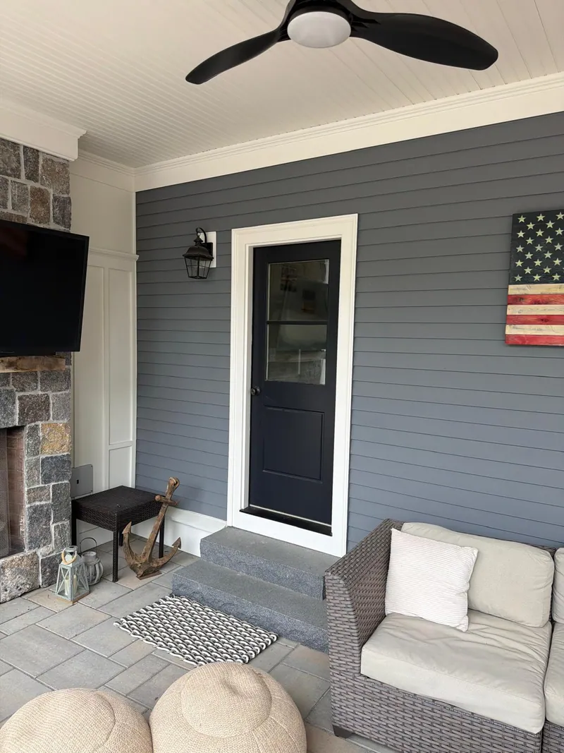 Covered porch & stone fireplace