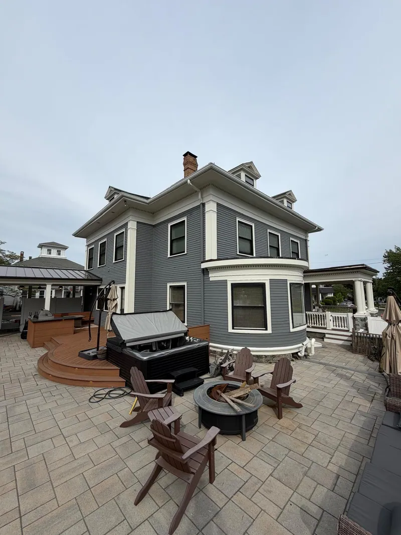 Victorian home finished in slate grey with white trim