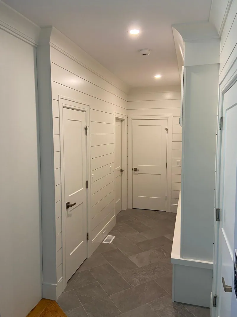 Repaired and repainted hallway with clean ceiling line